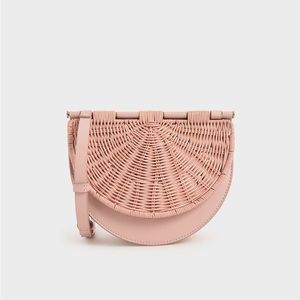 Charles & Keith: Pink Rattan Semi-Circle Crossbody Bag
